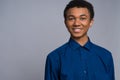 Happy African American teenager in denim shirt. Royalty Free Stock Photo