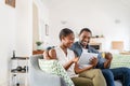 Mature black couple doing online shopping with credit card card at home Royalty Free Stock Photo