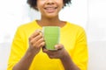Happy african american woman drinking from tea cup Royalty Free Stock Photo