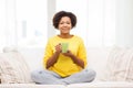 Happy african american woman drinking from tea cup Royalty Free Stock Photo