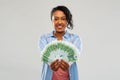 Happy african american woman holding euro money Royalty Free Stock Photo