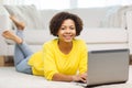 Happy african american woman with laptop at home Royalty Free Stock Photo