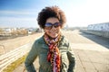 Happy african american woman in shades on street Royalty Free Stock Photo