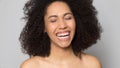 Happy African American woman show healthy white teeth Royalty Free Stock Photo