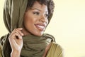 Happy African American woman with a stole over head looking away
