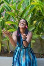 Happy African American Woman Tosses Flower Petals Into The Air Royalty Free Stock Photo