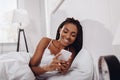 happy african american woman using smartphone Royalty Free Stock Photo