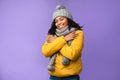 Happy African American Woman Wearing Warm Winter Clothes, Purple Background Royalty Free Stock Photo