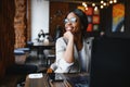 Happy african american woman worker using laptop work study at computer in loft office or cafe, smiling mixed race female student Royalty Free Stock Photo