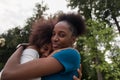 Happy African American women cuddle, friends Royalty Free Stock Photo