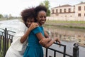 Happy African American women cuddle, friends Royalty Free Stock Photo