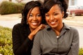 Happy African American women laughing and smiling.