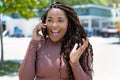 Happy african american young adult woman talking with boyfriend at phone Royalty Free Stock Photo