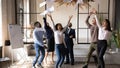 Happy african american young employee enjoying friday party with colleagues. Royalty Free Stock Photo