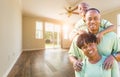 Happy African American Young Family In Empty Room of House Royalty Free Stock Photo