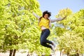Happy african american young woman in summer park Royalty Free Stock Photo