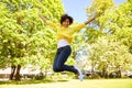 Happy african american young woman in summer park Royalty Free Stock Photo