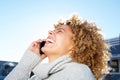 Happy african american young woman talking on cellphone Royalty Free Stock Photo