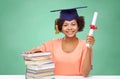 Happy african bachelor girl with books and diploma Royalty Free Stock Photo