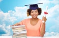 Happy african bachelor girl with books and diploma Royalty Free Stock Photo