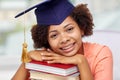 Happy african bachelor girl with books at home Royalty Free Stock Photo