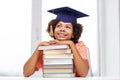 Happy african bachelor girl with books at home Royalty Free Stock Photo