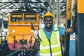 happy african black worker engineer male working heavy industry train locomotive service staff smiling portrait