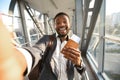 Businessman Traveler Making Selfie With Passport And Tickets In Airport