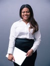 Happy african businesswoman holding laptop Royalty Free Stock Photo