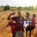 Happy African children with soccer football ball playing ball