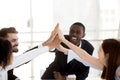 Happy african coach and diverse team people giving high five Royalty Free Stock Photo