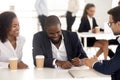 Happy african couple sign mortgage contract meeting with bank manager Royalty Free Stock Photo