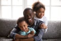 Happy african dad and mixed race children at home portrait Royalty Free Stock Photo