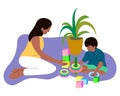 Happy African Dark Skin Mother andÂ Son Playing.Â Young Adult Parent. Boy Sit next to his Mother. Royalty Free Stock Photo