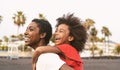 Happy African family on the beach during summer holidays - Afro American people having fun on vacation time Royalty Free Stock Photo