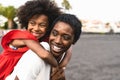 Happy African family having fun on the beach during summer holidays - Afro mother and daughter enjoying vacation days Royalty Free Stock Photo