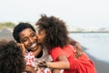 Happy African family having fun on the beach during summer holidays - Afro people enjoying vacation days Royalty Free Stock Photo