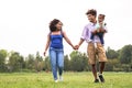 Happy African family having fun in public park - Mother and father with their daughter enjoying time together Royalty Free Stock Photo