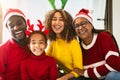 Happy African family having fun celebrating Christmas holidays Royalty Free Stock Photo