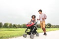 Happy African family having fun together in public park - Afro mother and father with their daughter enjoying time together Royalty Free Stock Photo