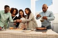 Happy African family preparing a dinner on house patio Royalty Free Stock Photo