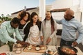 Happy African family preparing food recipe on house patio Royalty Free Stock Photo
