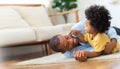 Happy African Father and little child son spending time playing at home together Royalty Free Stock Photo