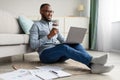 Happy African Freelancer Man Using Laptop Working From Home Royalty Free Stock Photo