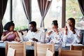 Happy african friends in cafe. Royalty Free Stock Photo