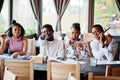 Happy african friends in cafe. Royalty Free Stock Photo