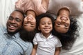 Happy african full family lying smiling looking at camera Royalty Free Stock Photo