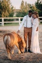 Interracial couple newlyweds at the ranch. Royalty Free Stock Photo