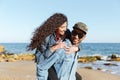 Happy african loving couple walking outdoors at beach Royalty Free Stock Photo