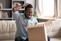 Happy african male customer hold cardboard box open post parcel Royalty Free Stock Photo